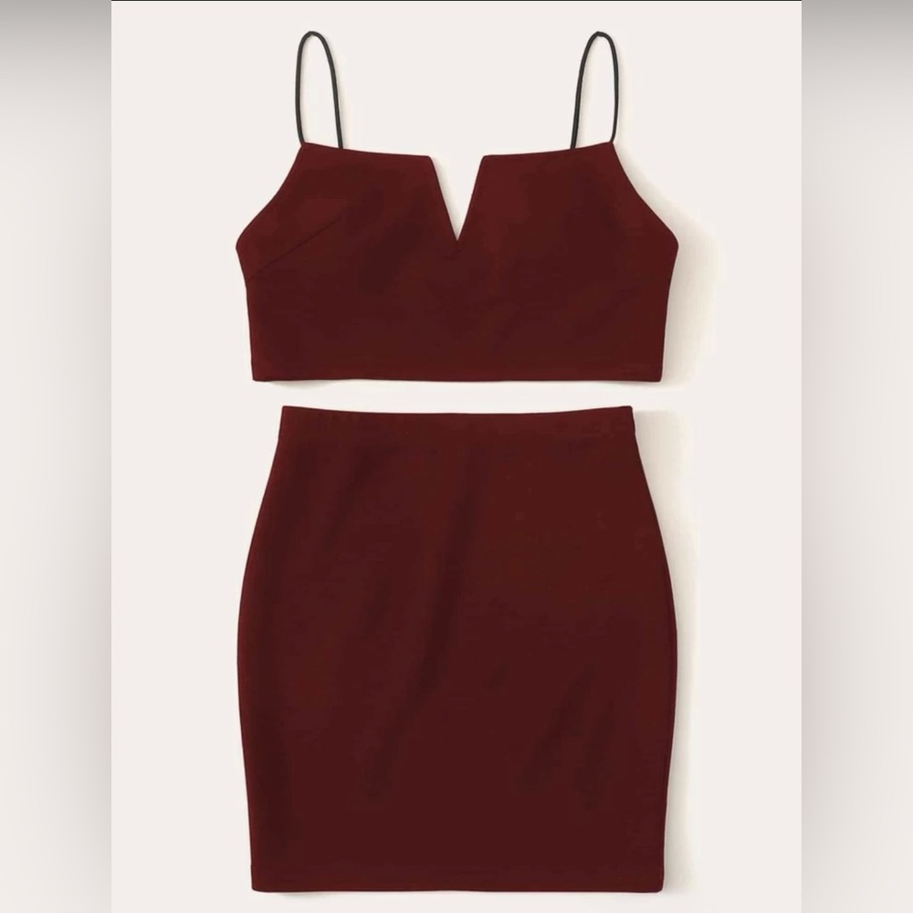 This is a Burgundy top and skirt set large with a spaghetti strap top